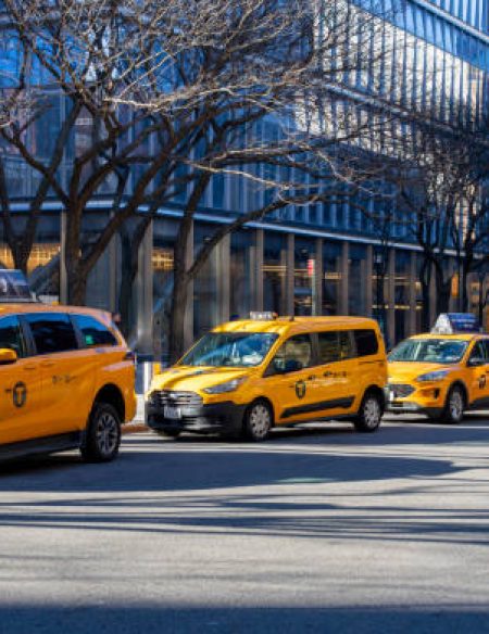 Greenwich village, Manhattan, New York, USA - March, 2024. Yellow taxi rank with queue of taxis in Greenwich Village, Manhattan, New York.